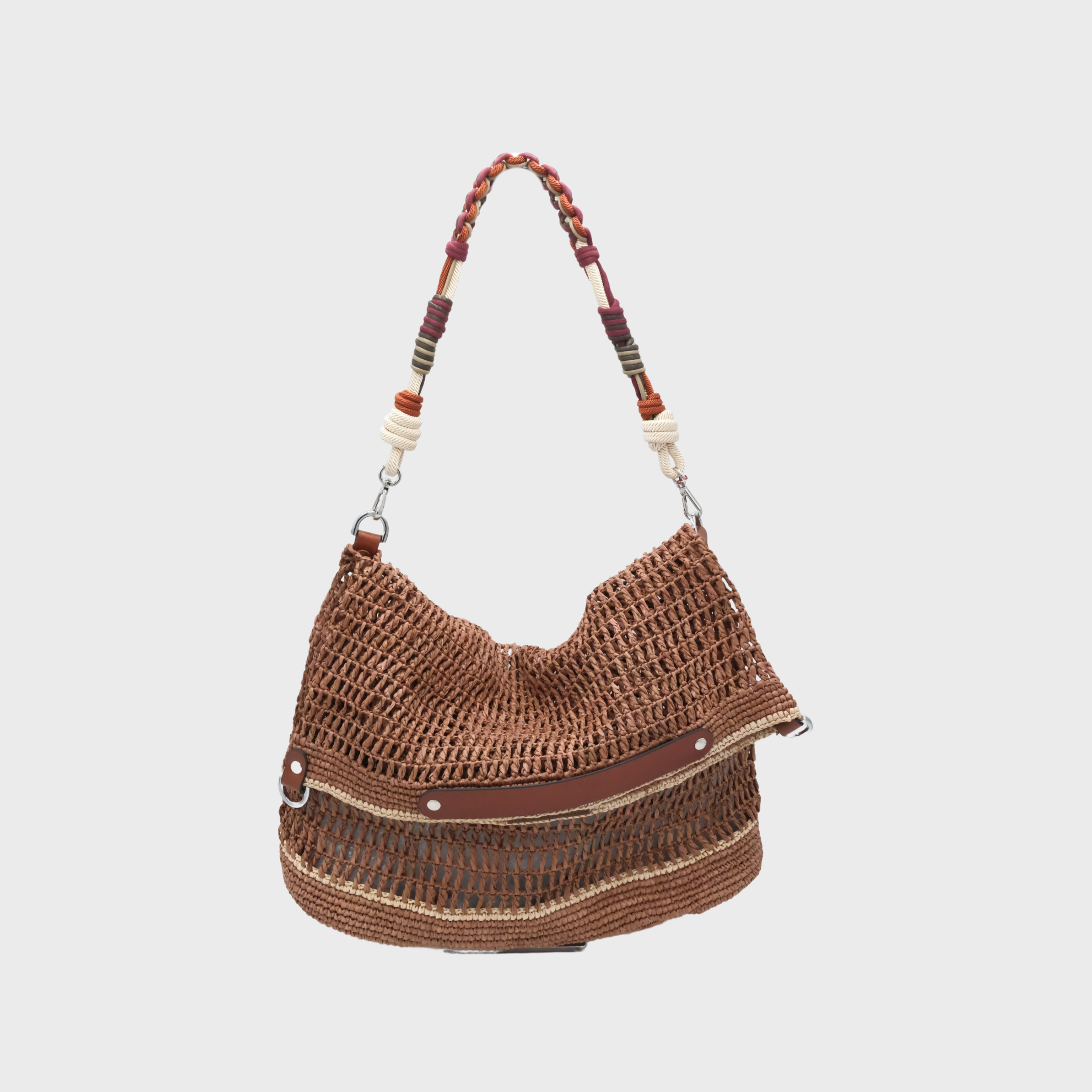 A Brown raffia Colin Tote Bag with beige stripes and a square weaving, hanging by a burgundy, dark purple and orange beaded bag strap. 