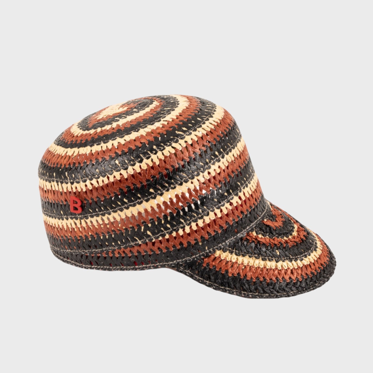 A brown, beige and black striped raffia cap n the side. 