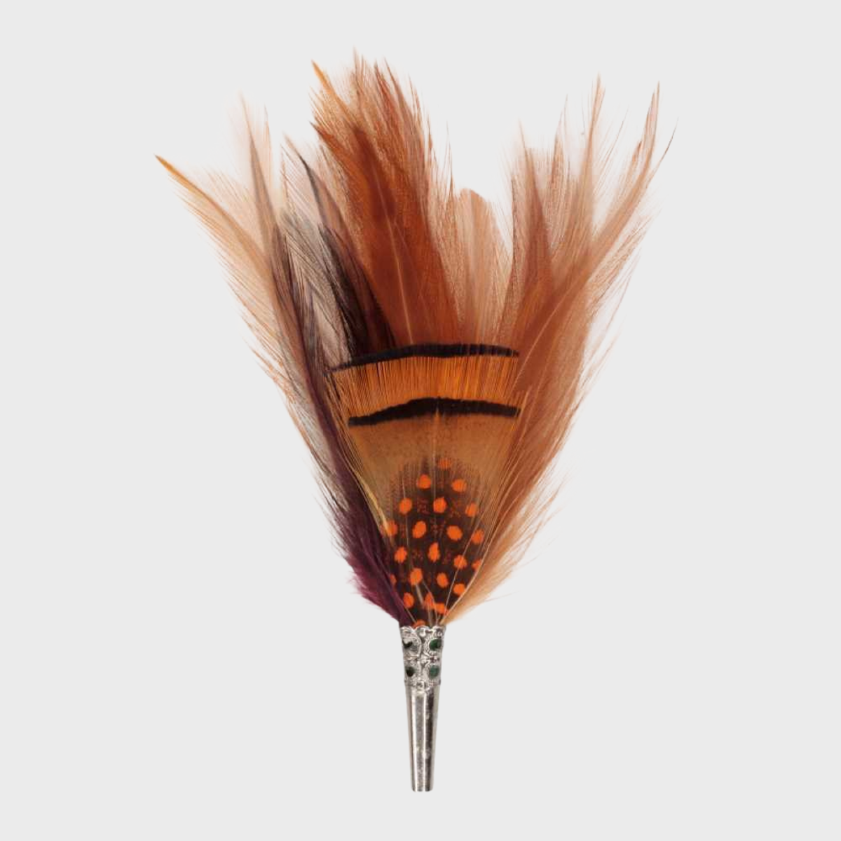 A feather brooch with brown, orange and purple feathers. 
