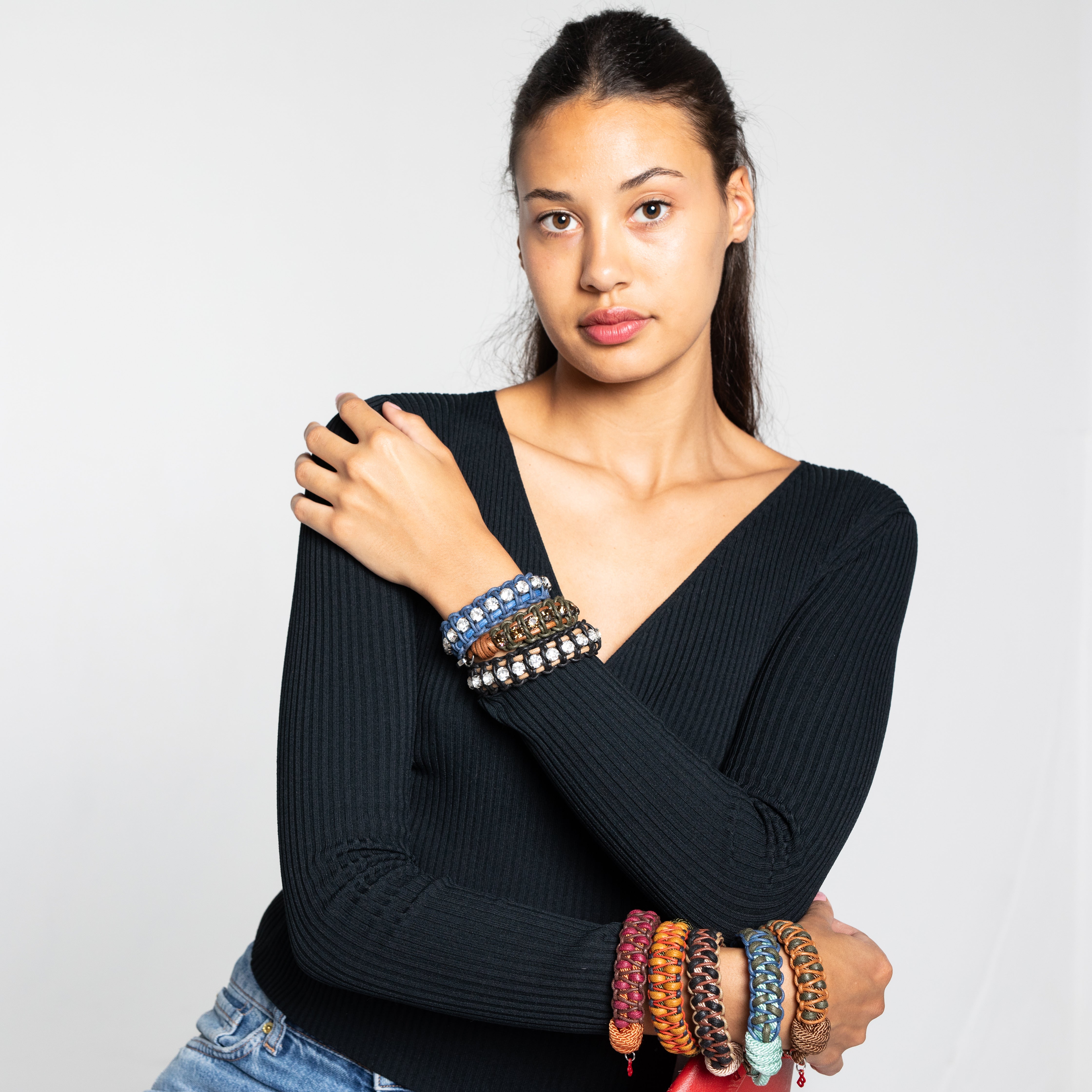 A woman wearing several bracelets 