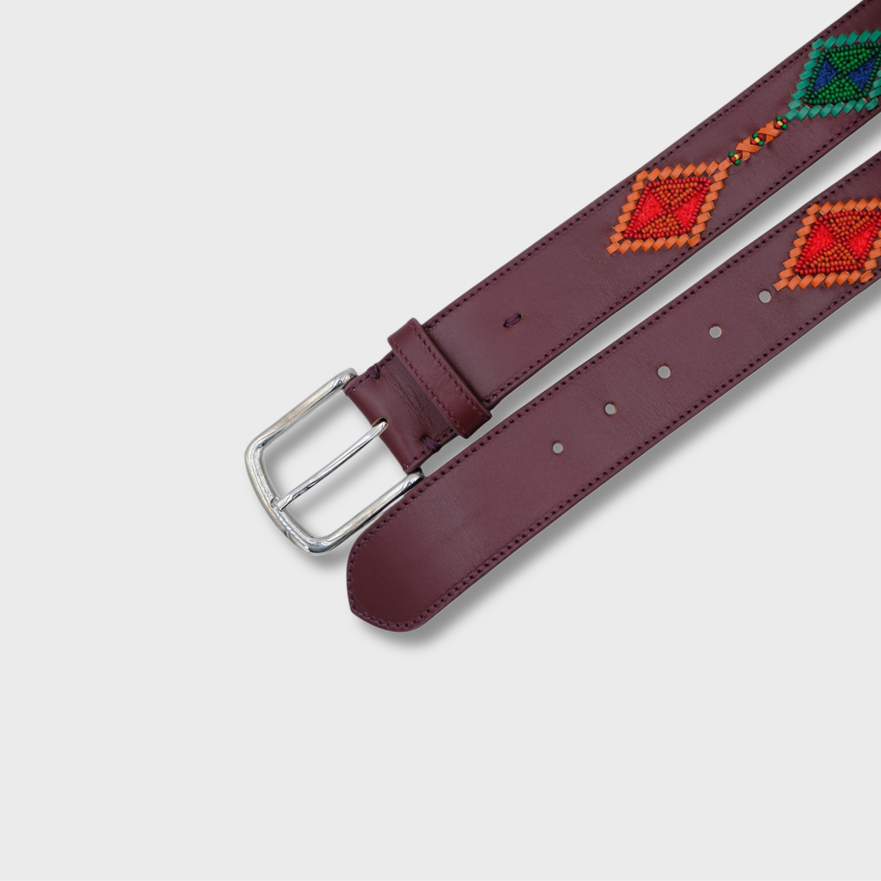 Close-up of the Reds & Blues with Burgundy Cherokee belt showing leather and bead detail