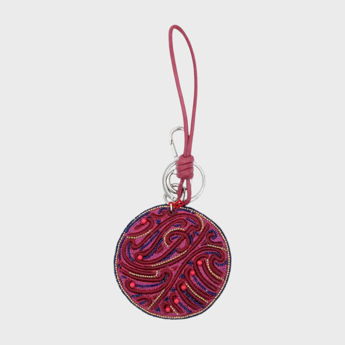 Embroidered keychain with pink and purple design on a white background