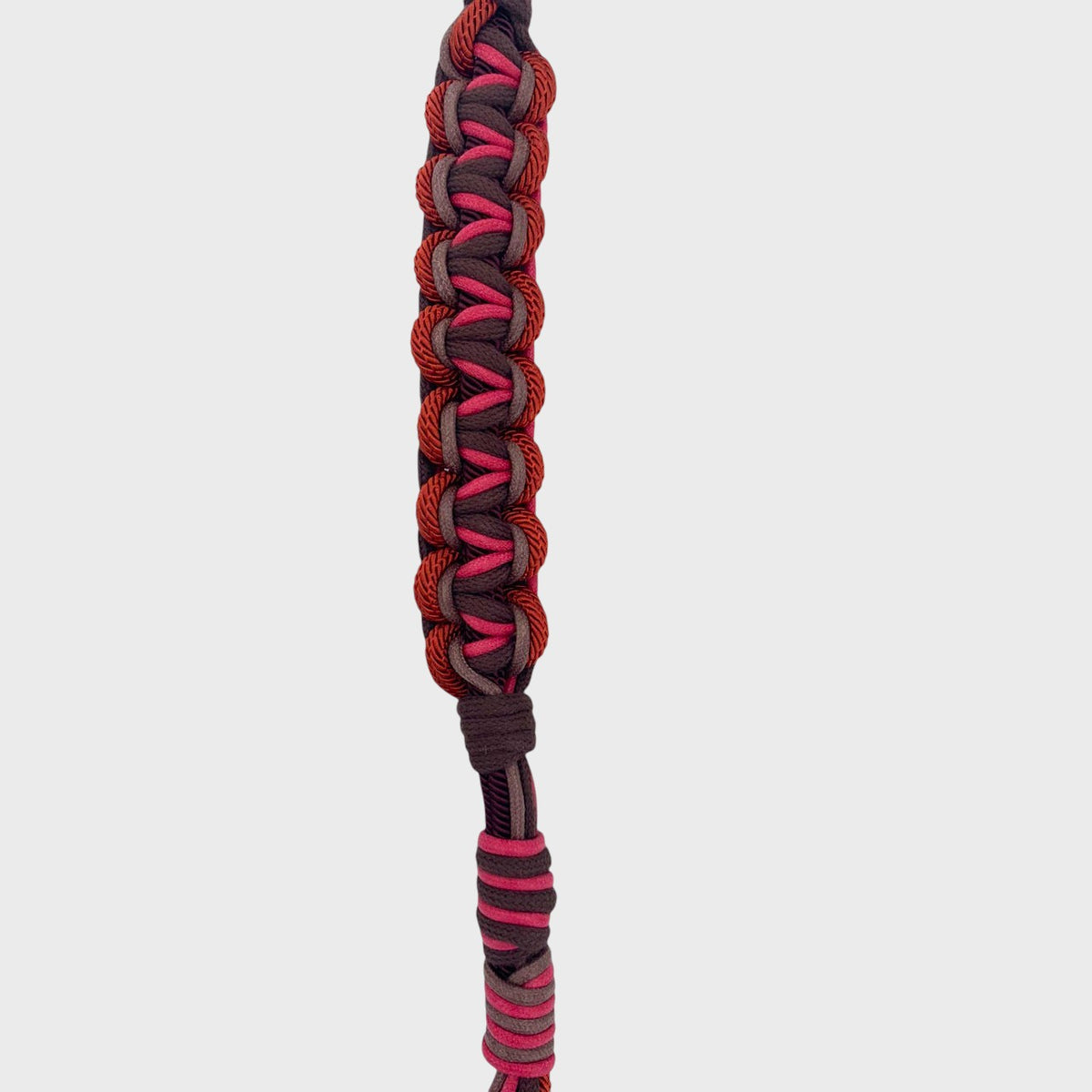 The detail of the brunt cherry macramé bag strap. 