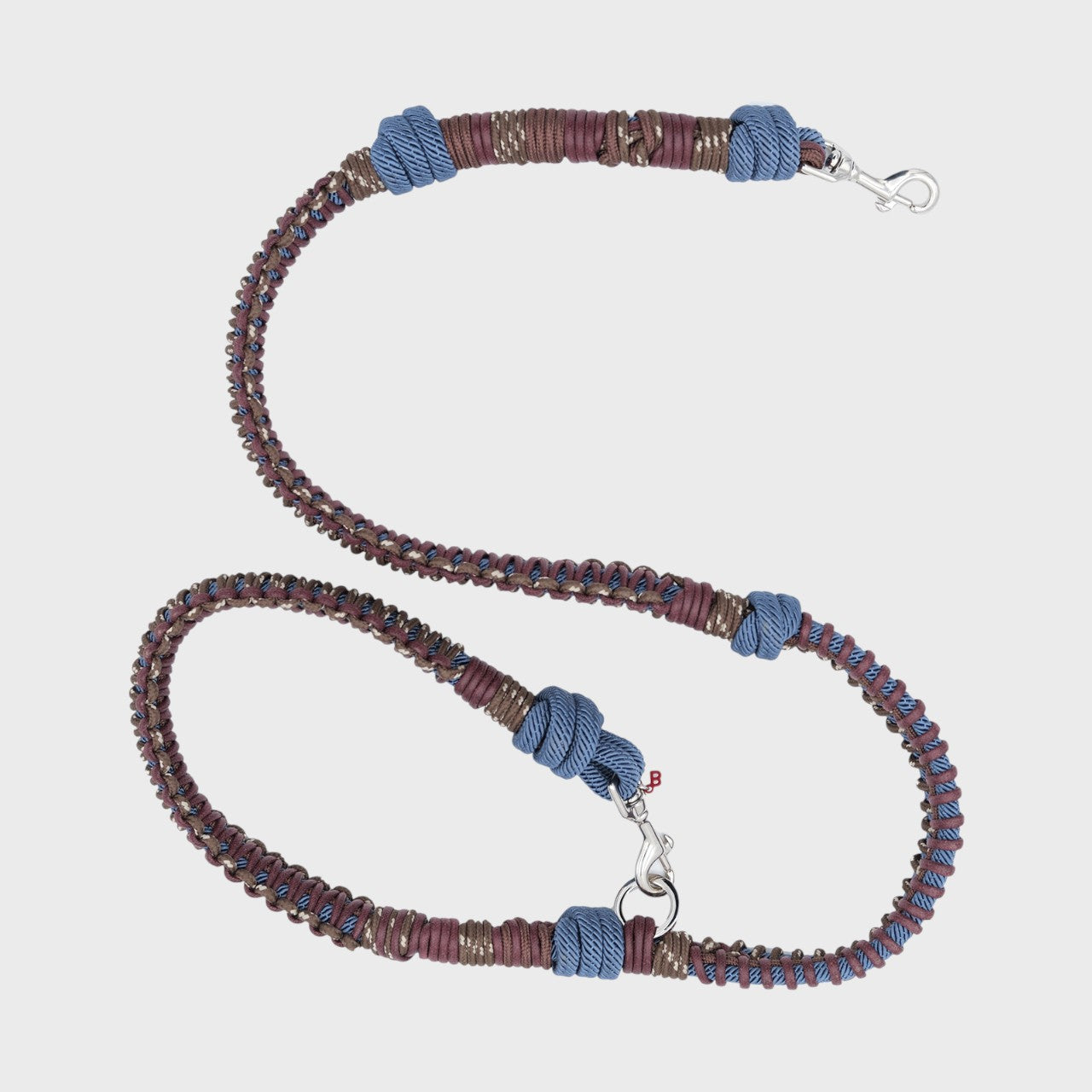 A close-up of the brown and blue macramé dog leash.