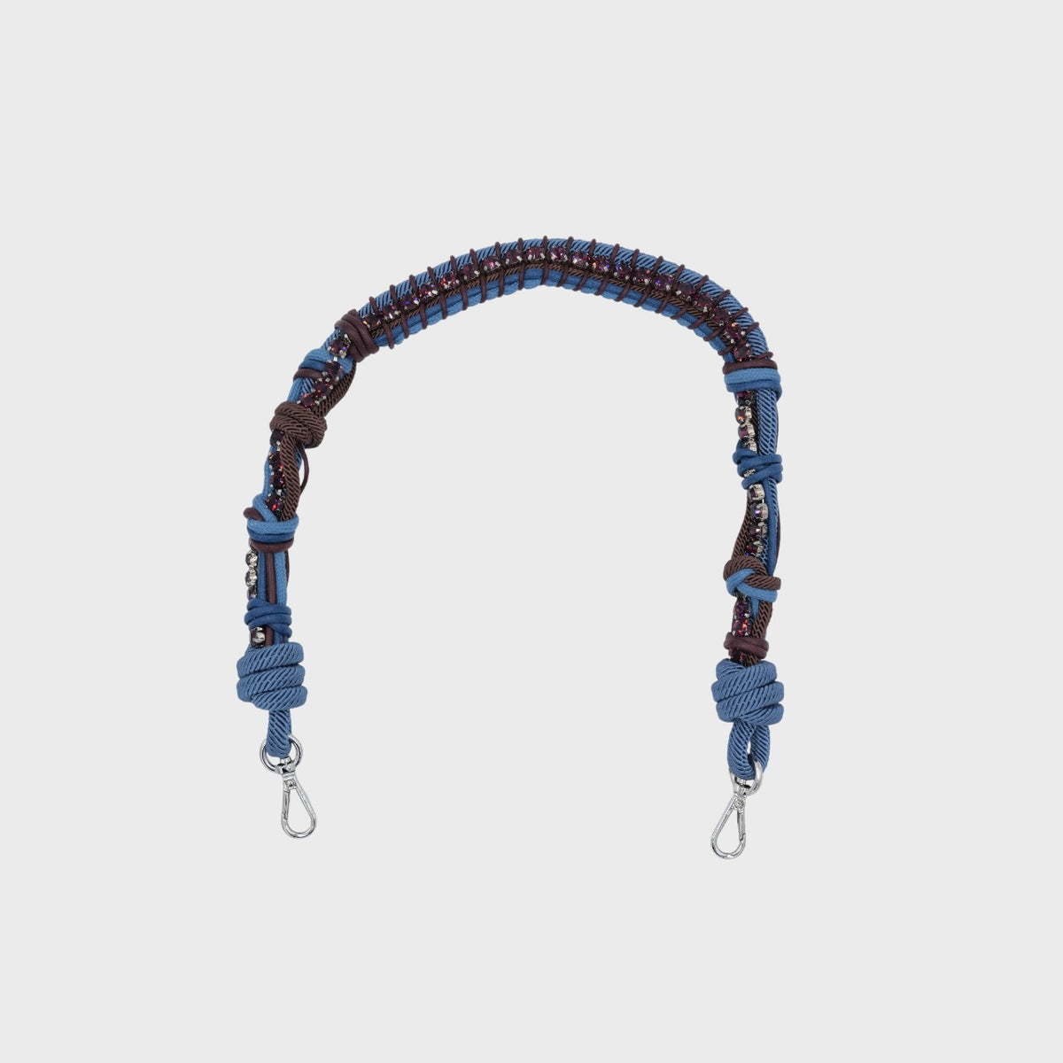 Macramé Blue and brown woven strap with purple rhinestones with metal hooks on a white background