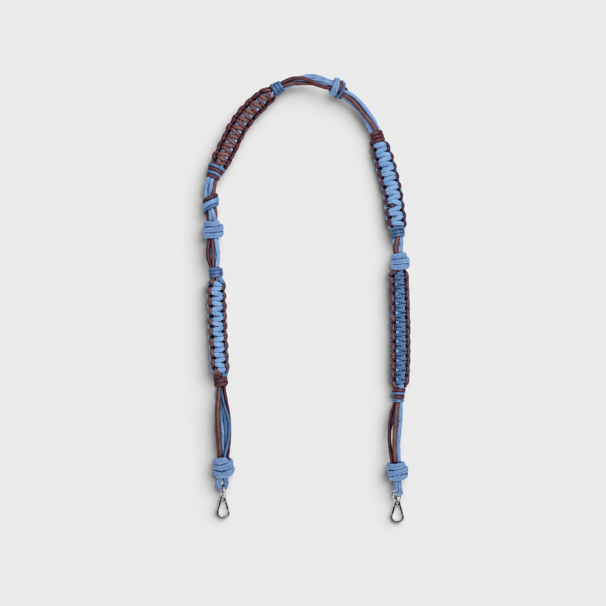 A macramé chocolate and blue bag strap. 