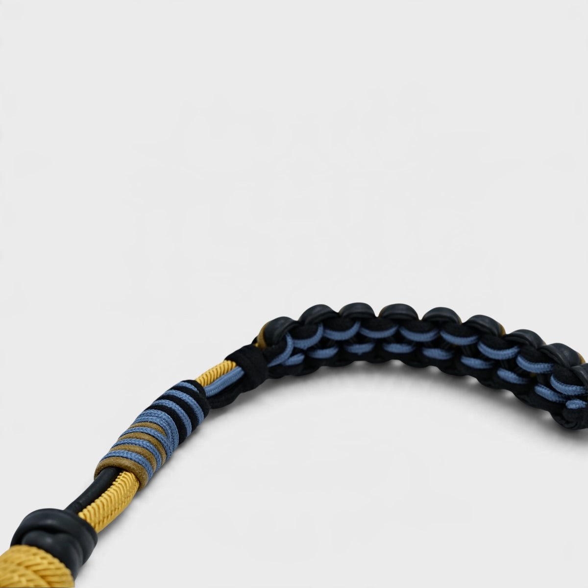 The detail of the macramé braided bag strap. 