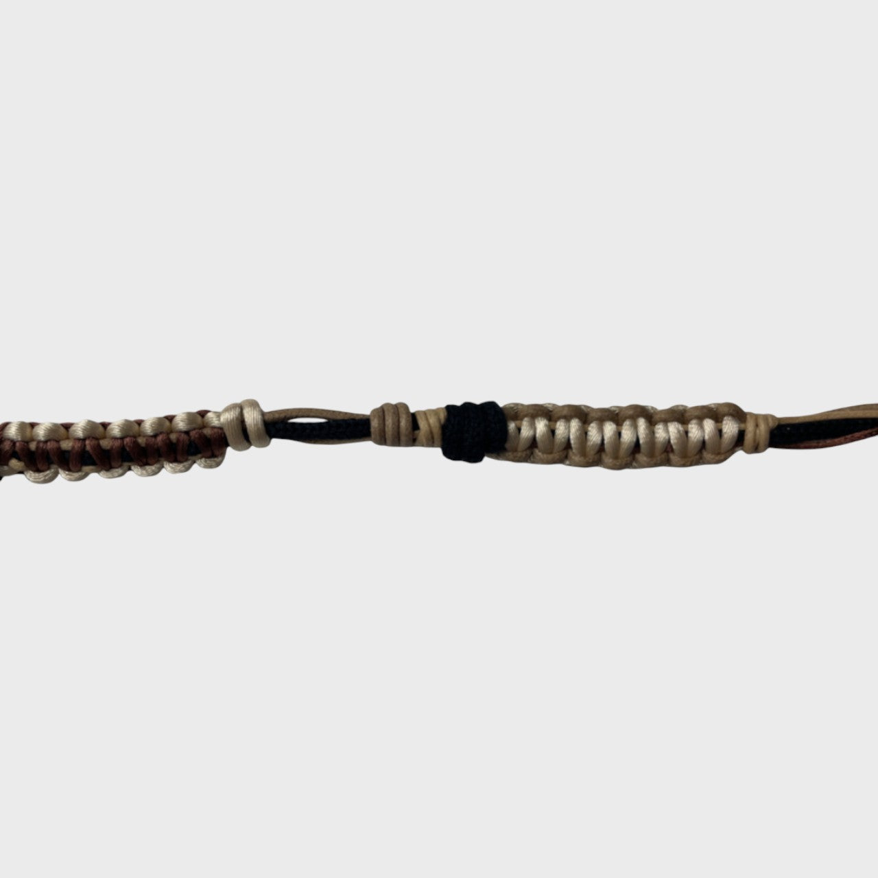 Eyeglasses holder with beige, black and brown woven pattern on a white background