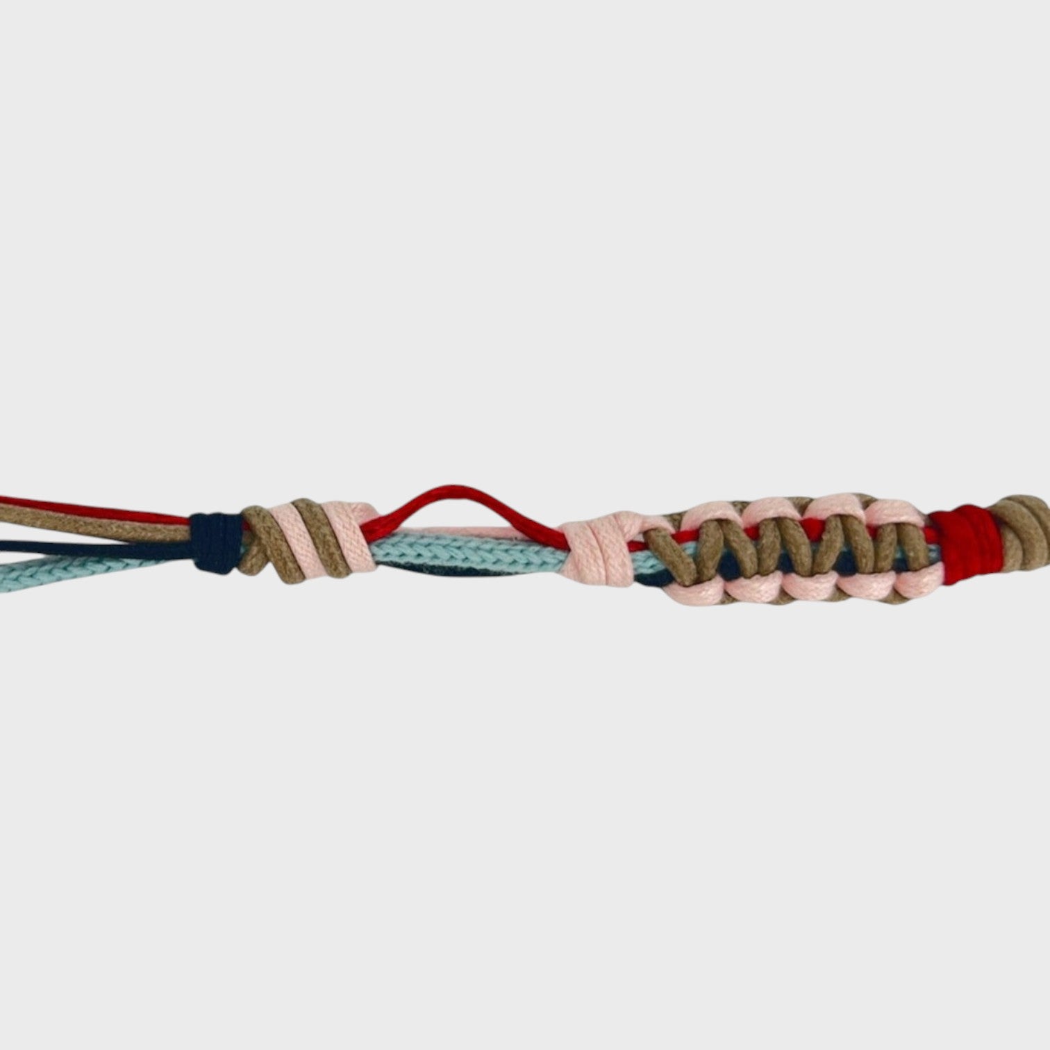 Eyeglasses holder with red, pink, light blue, dark blue and brown woven pattern on a white background