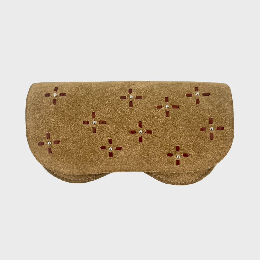 A brown suede leather glasses case with dark brown geometric cross designs embroidered on it. 