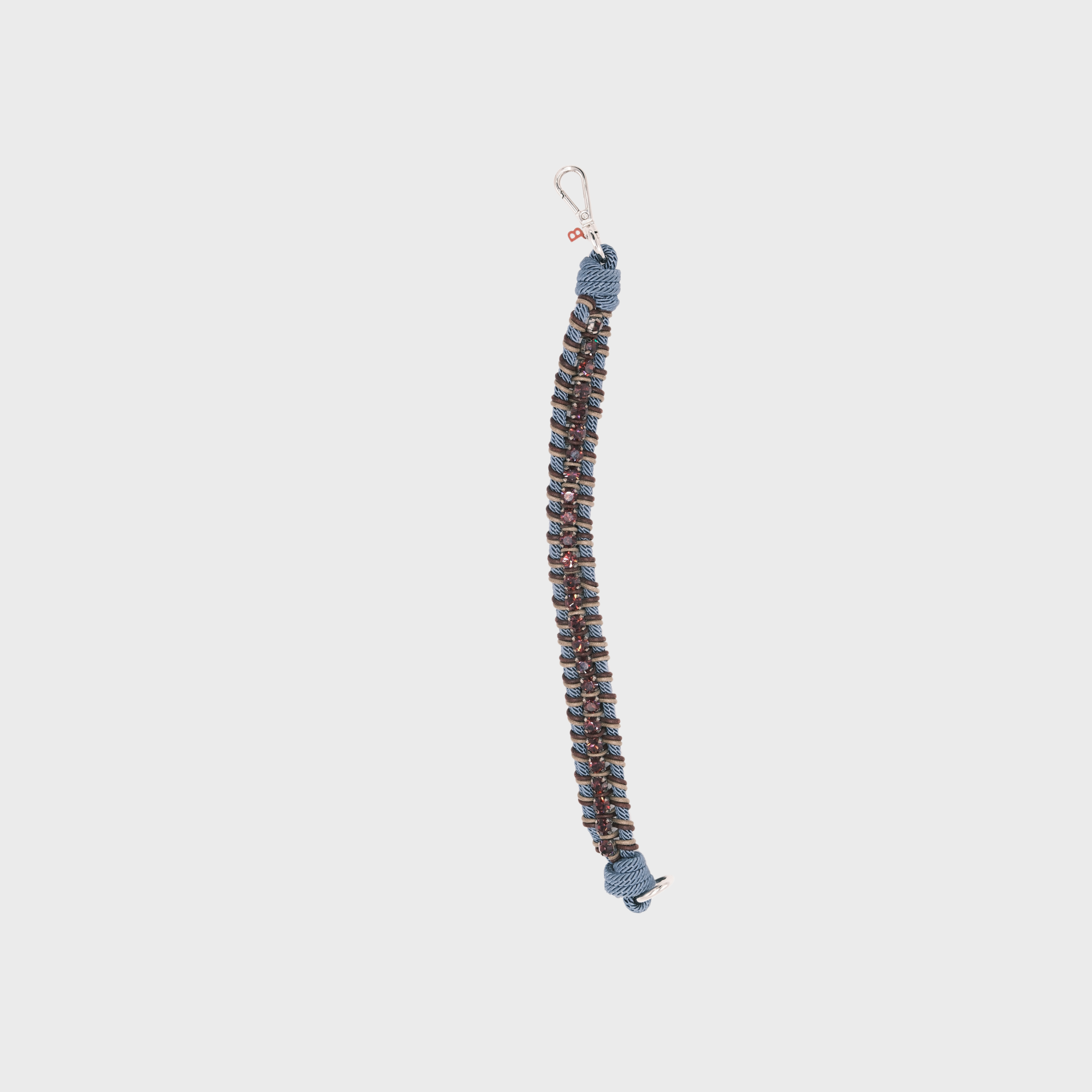 A braided macramé collar featuring blue, brown and beige cords with small purple beads.