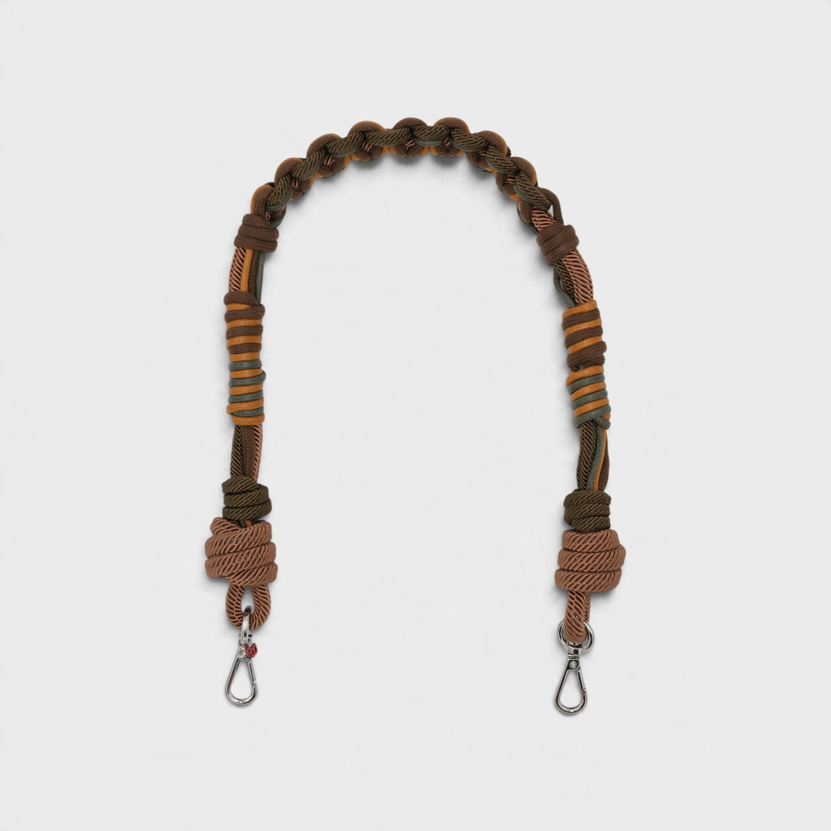 A brown and orange macramé bag strap with metal clasps, displayed on a light gray background.