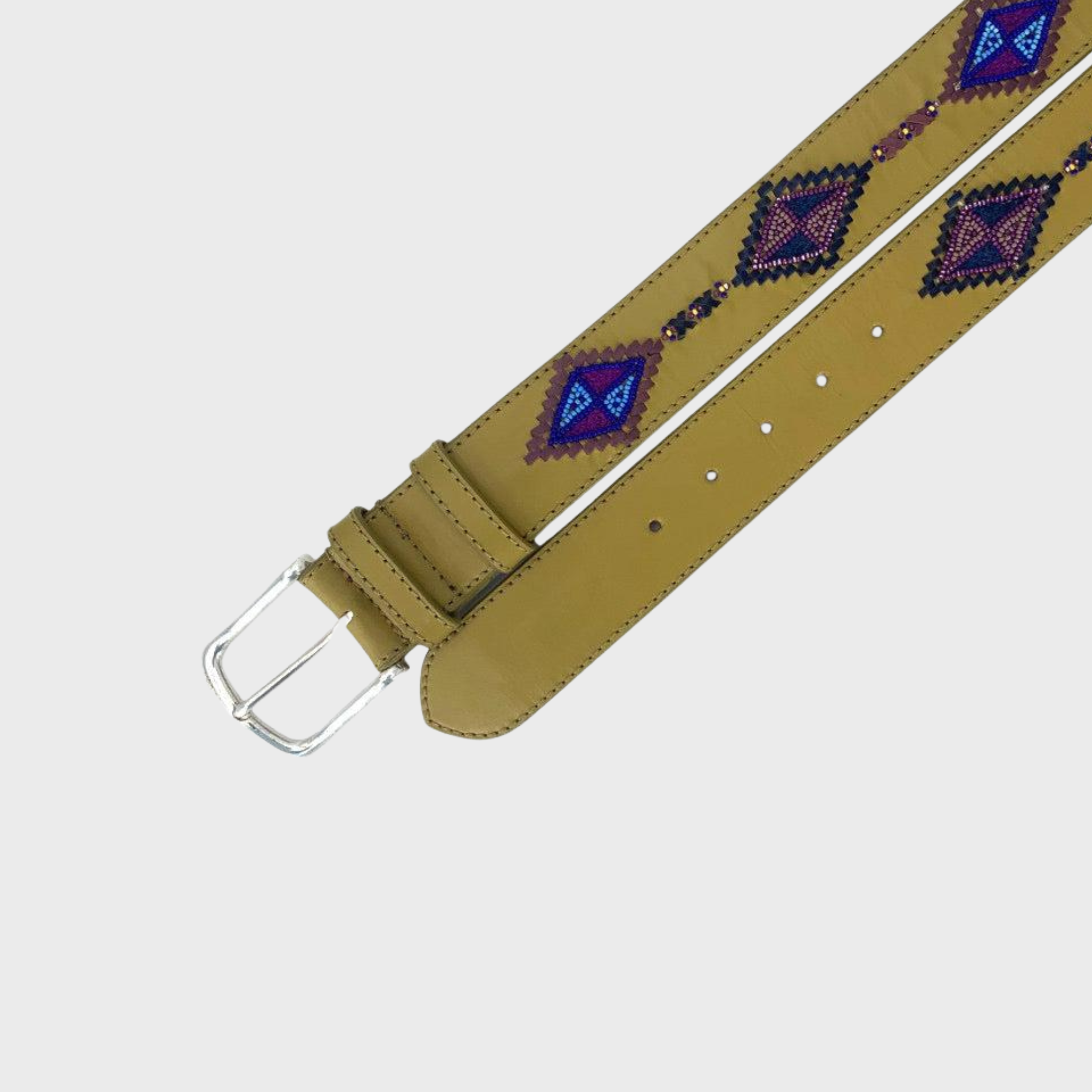 A brown leather belt with a silver buckle, featuring a diamond shaped pattern in blue, purple, and brown on the strap.