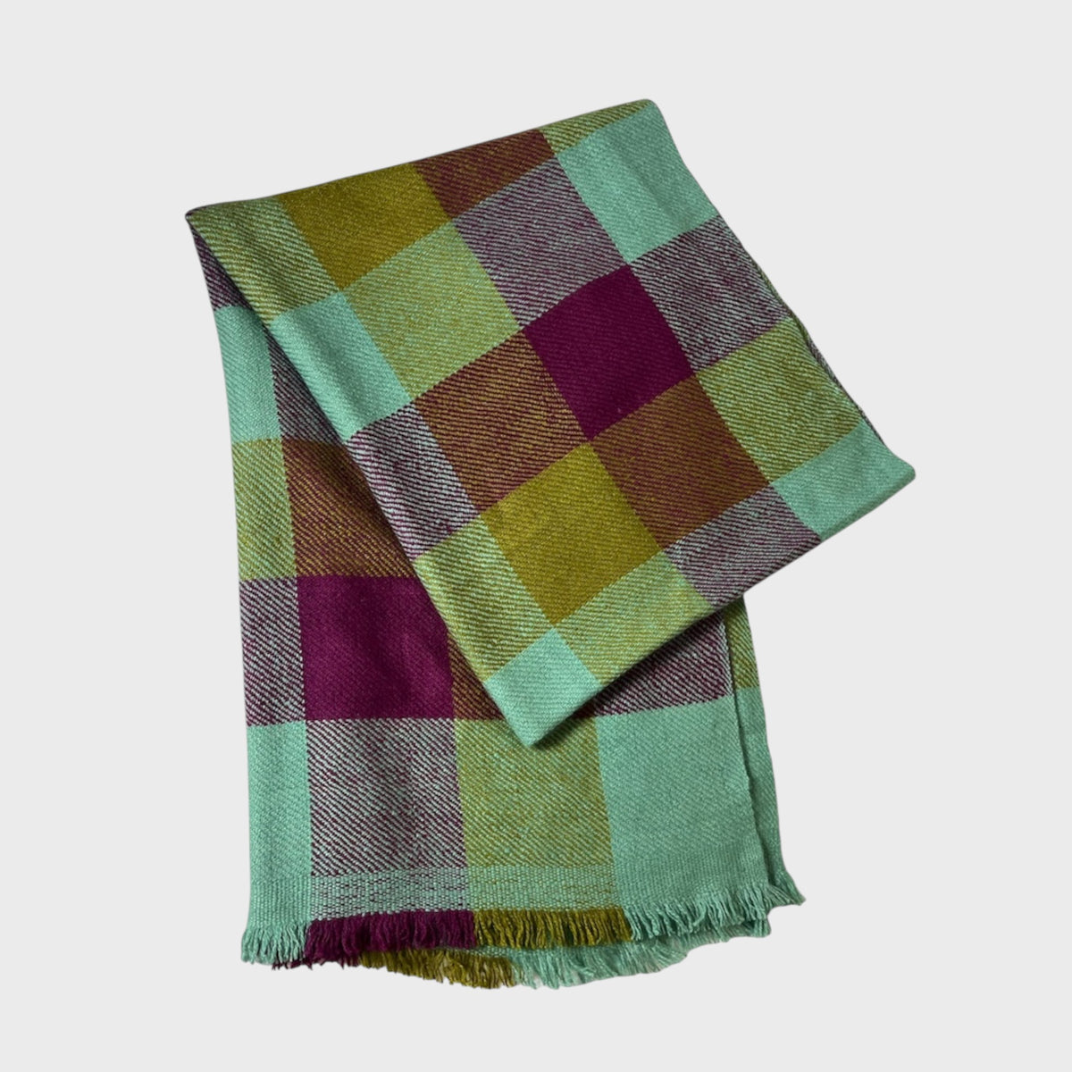 Cashmere Shawl with green, purple, and brown colors on a white background
