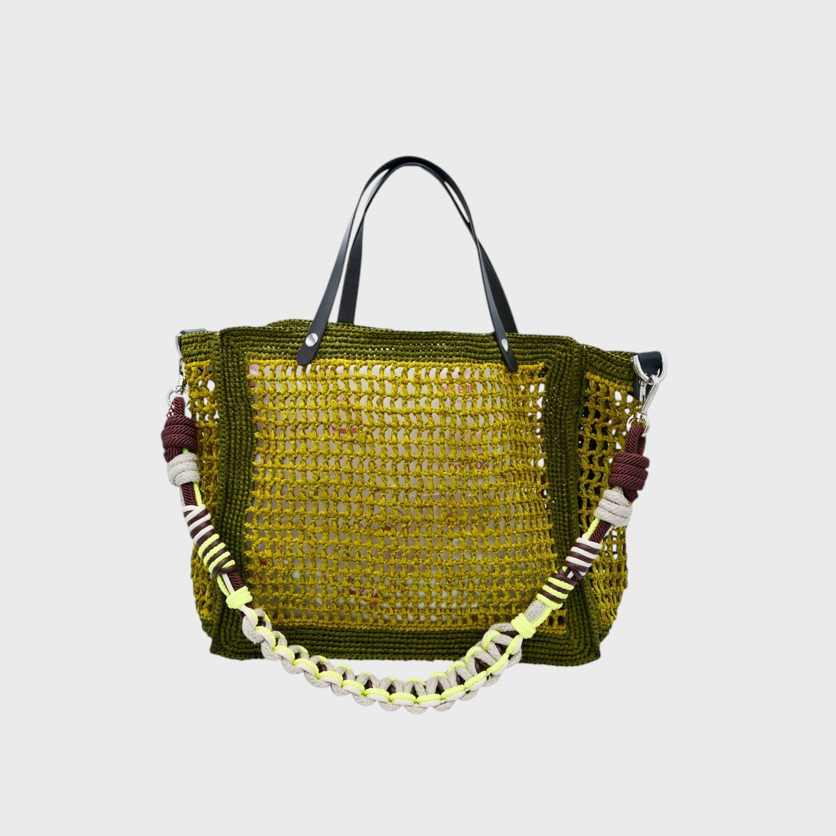 Raffia Cabas handbag with black leather handle and shades of green and neon yellow with a neon yellow strap. 