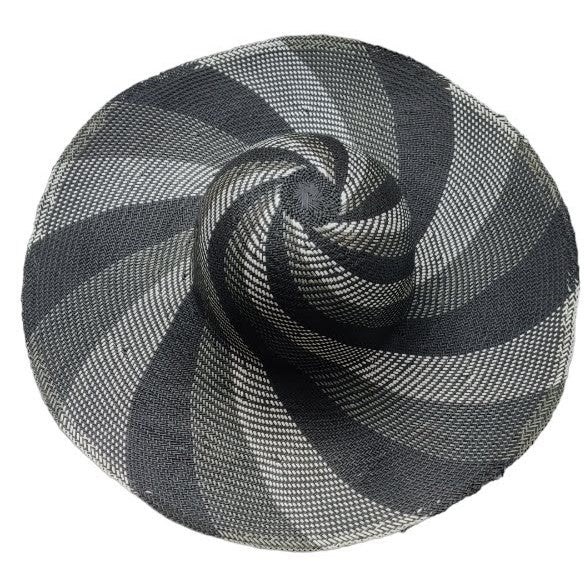 A grey striped raffia wide-brimmed hat. 