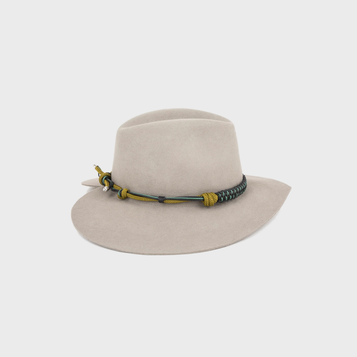 Grey wool hat shaped as a heart with a decorative band on a light gray background
