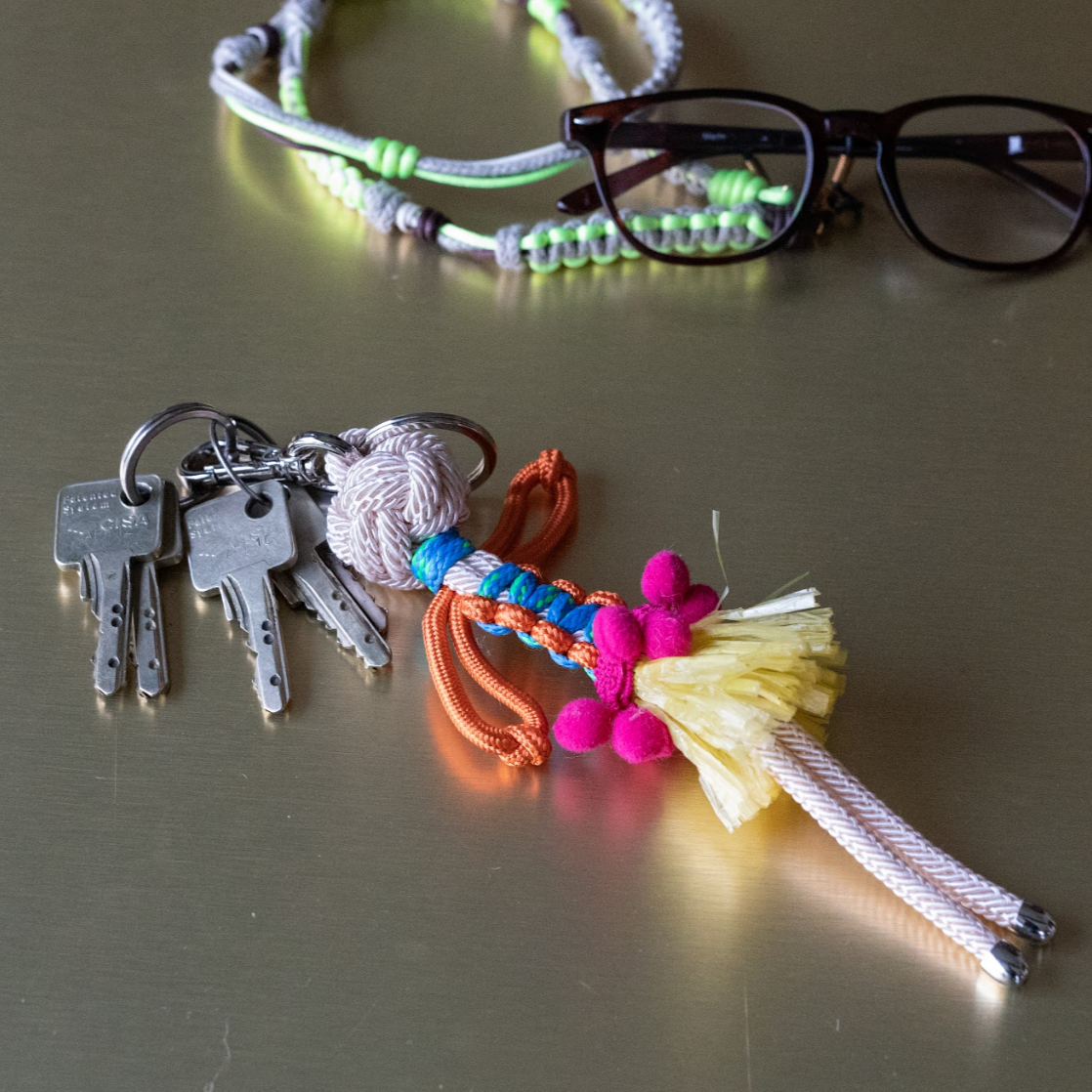 Mahine bag charm laid on table top with keys attached.