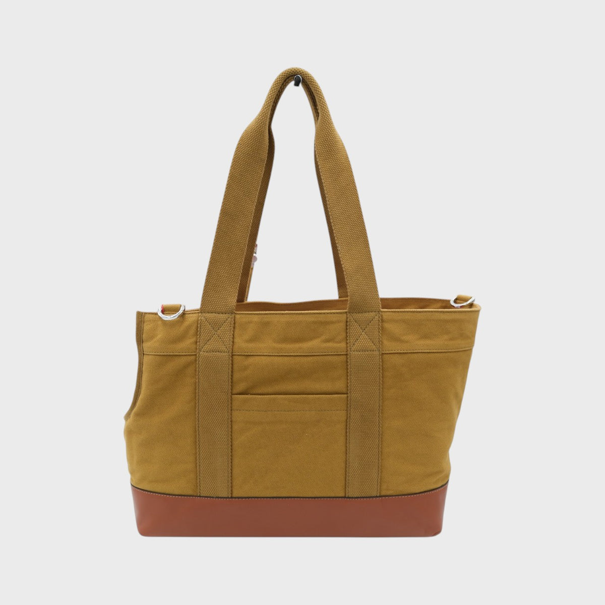 Mustard dog carrier bag with brown leatherbottom section on a white background