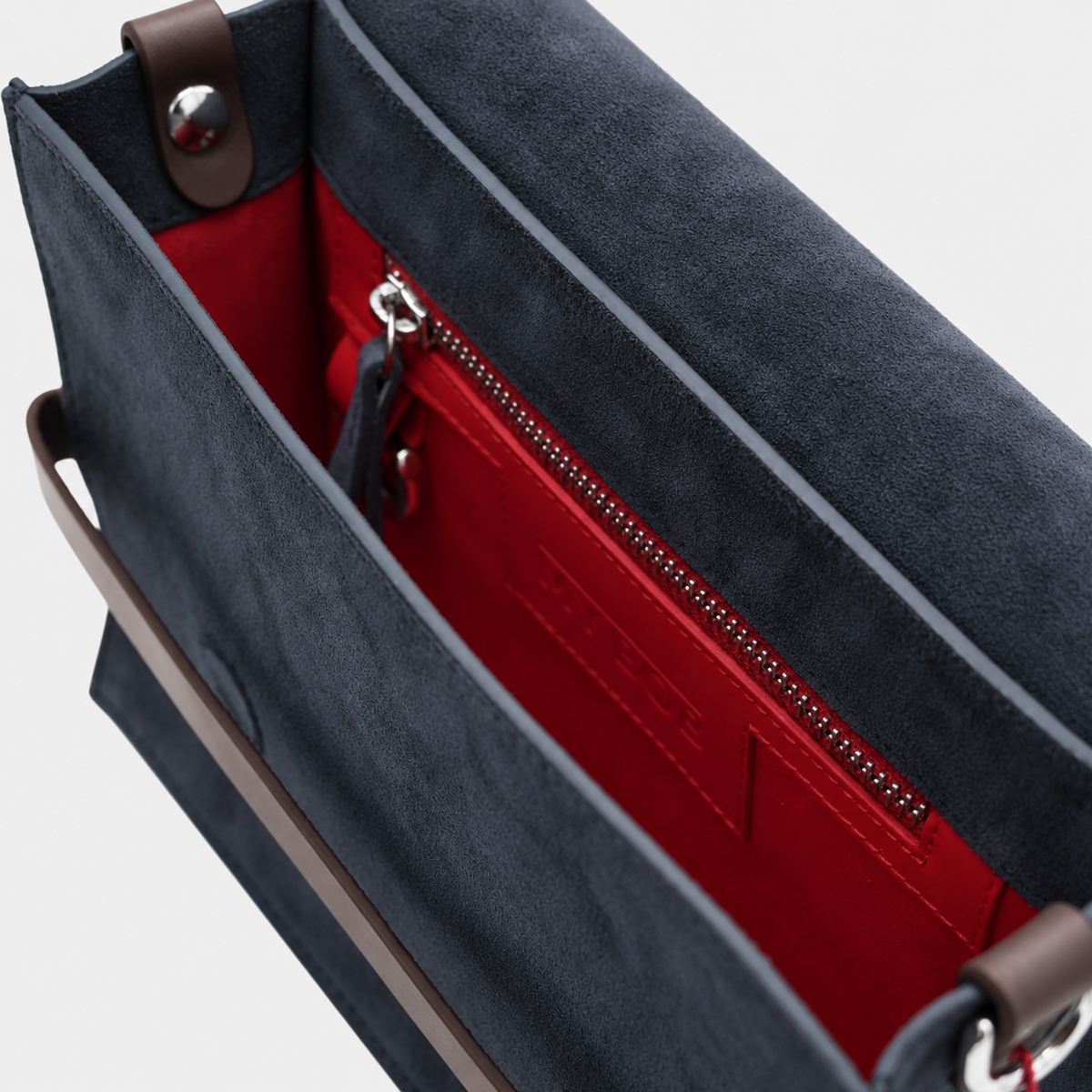 The interior of  suede leather bag in red genuine leather. 