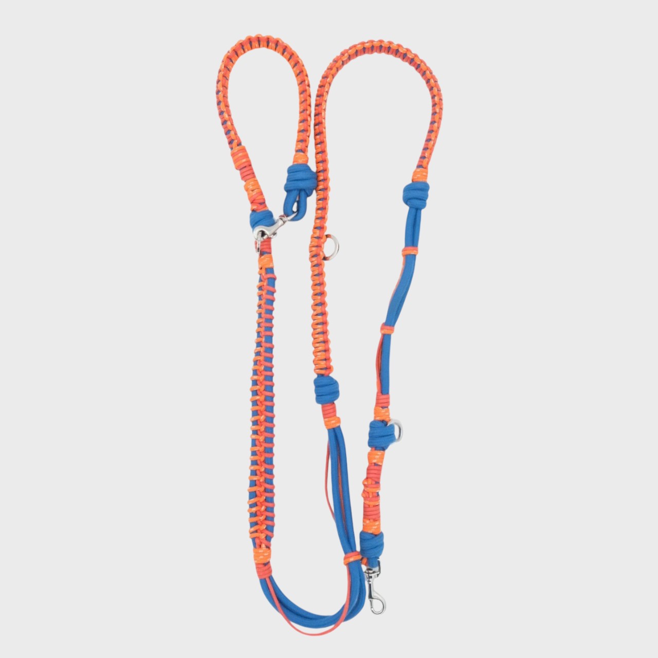 A braided macramé dog leash with neon orange and blue woven sections, and a silver metal hardware.