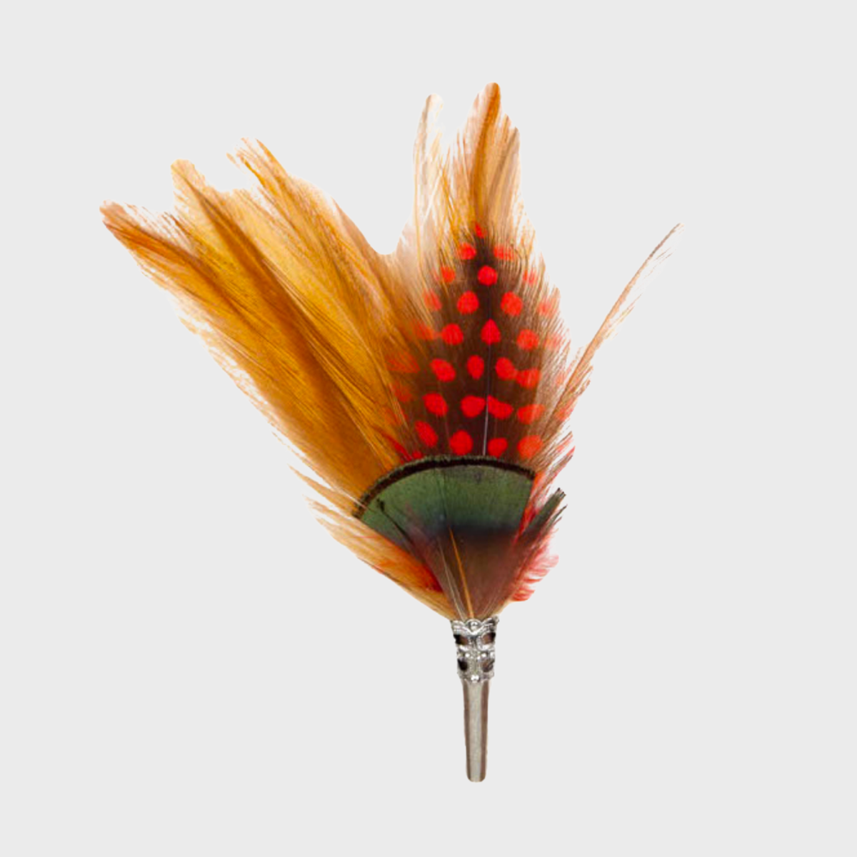 A feather brooch with orange, red and green feathers and a silver metal clasp. 
