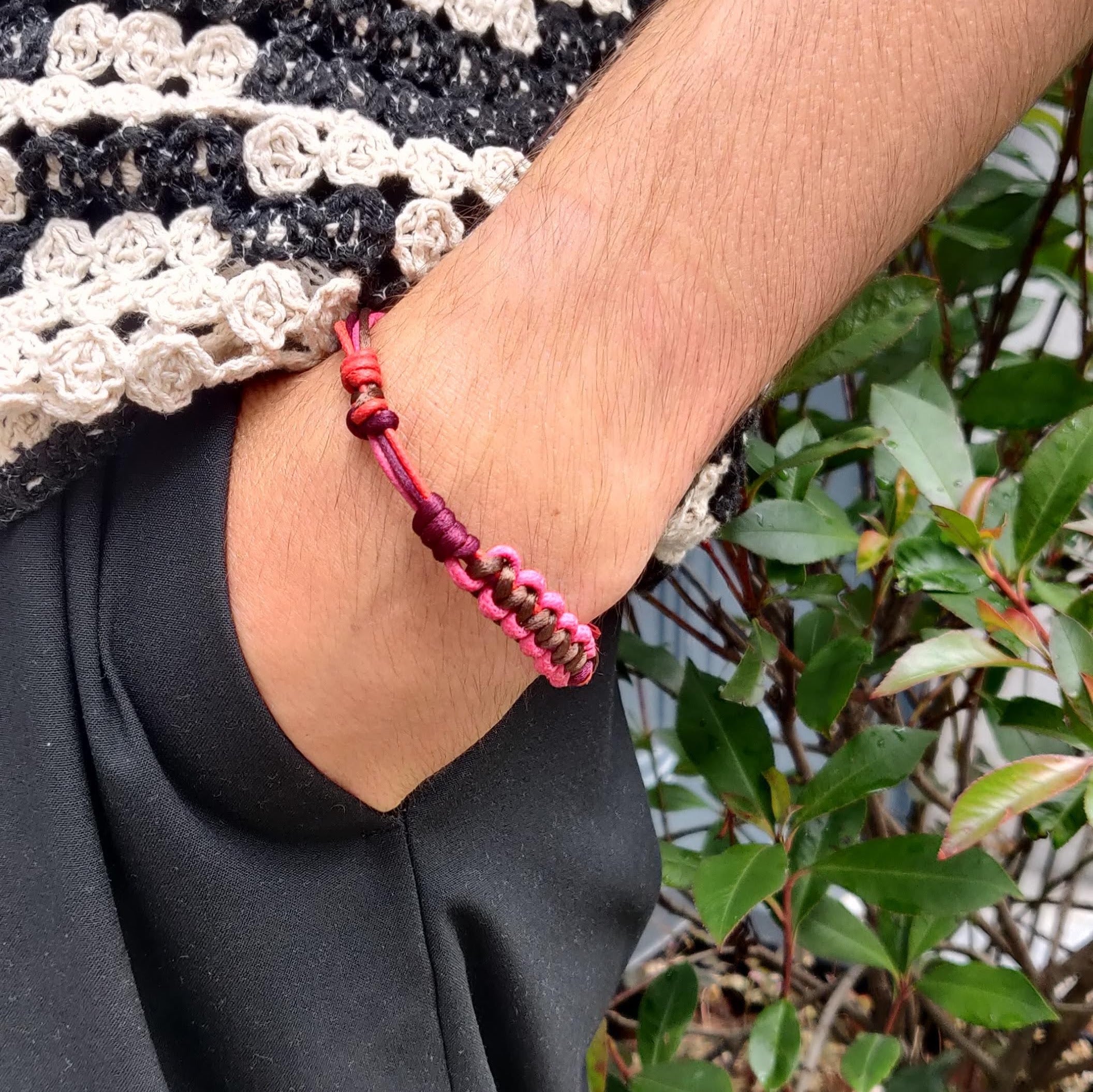 A model wearing the pink, brown and red Nino bracelet. 
