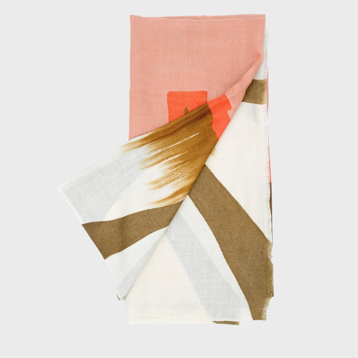 Colorful geometric-patterned cashmere shawl or scarf on a white background