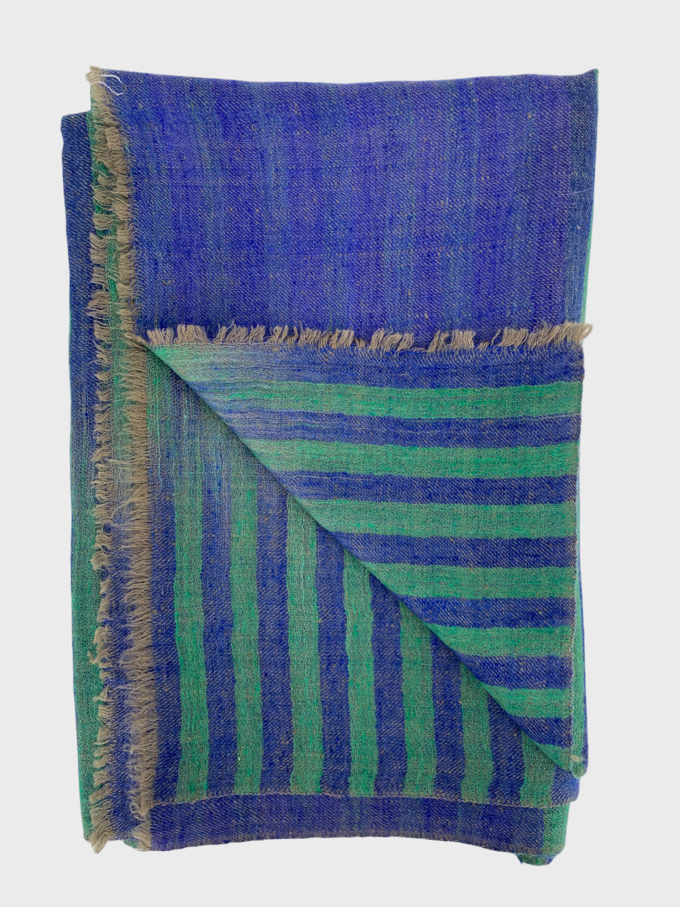 Folded cashmere shawl or scarf with blue and green striped pattern on a white background