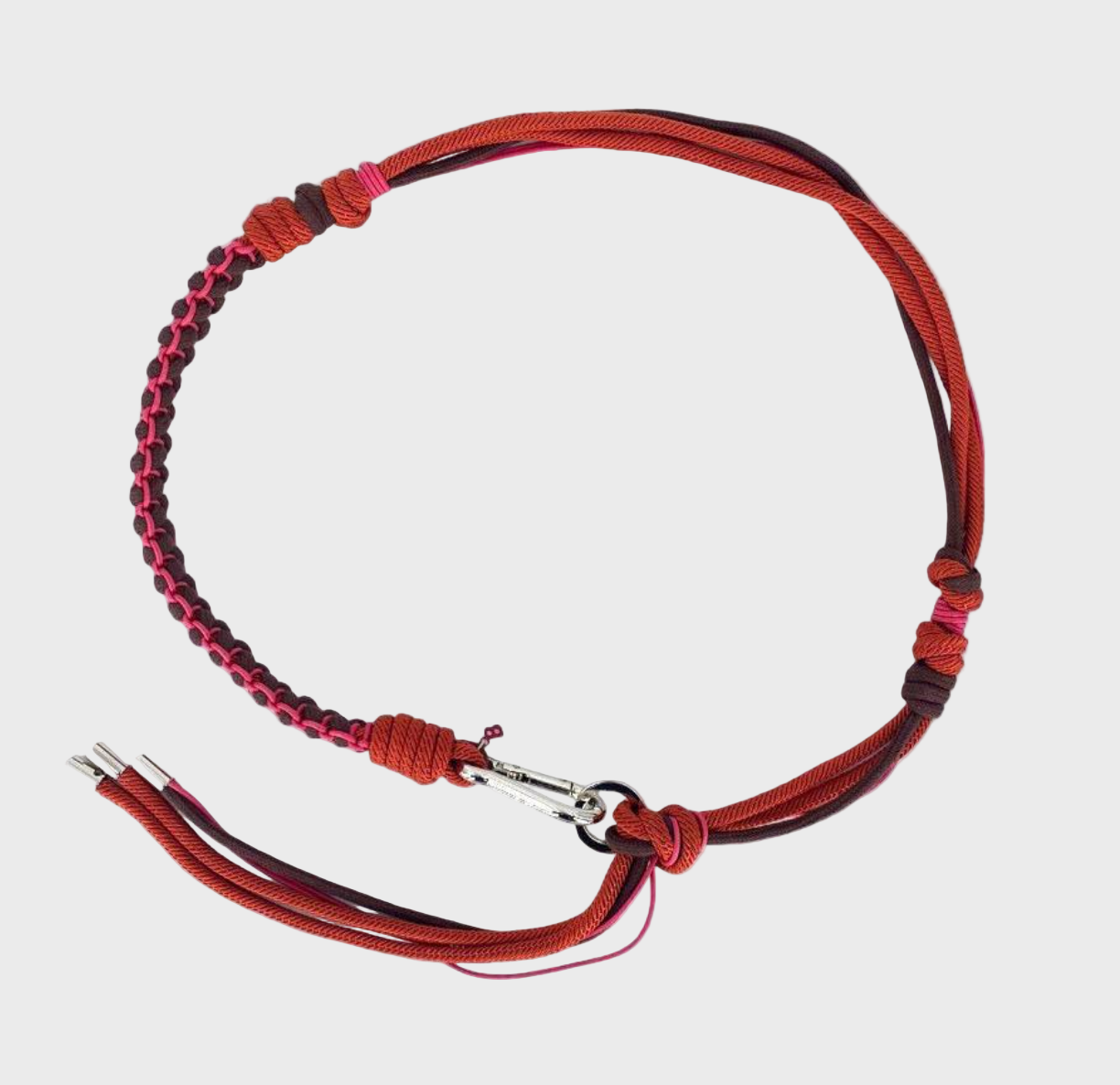 Red and pink handmade macramé belt with a silver clasp.