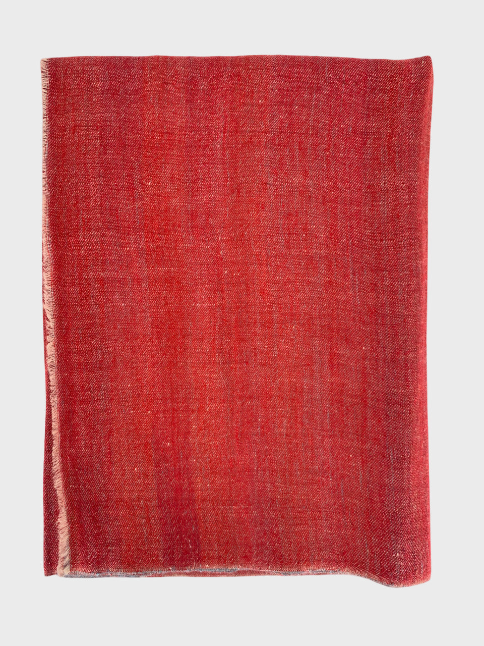 Red cashmere shawl on a white background