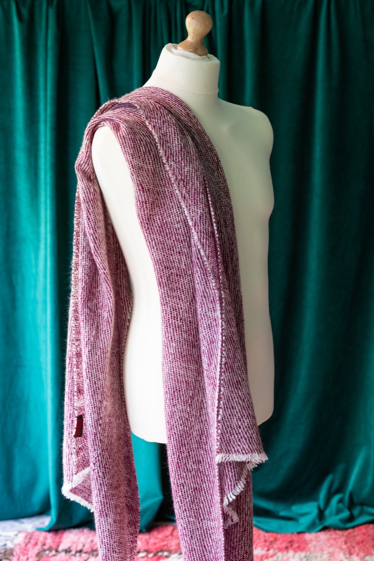 A red cashmere shawl or scarf. 