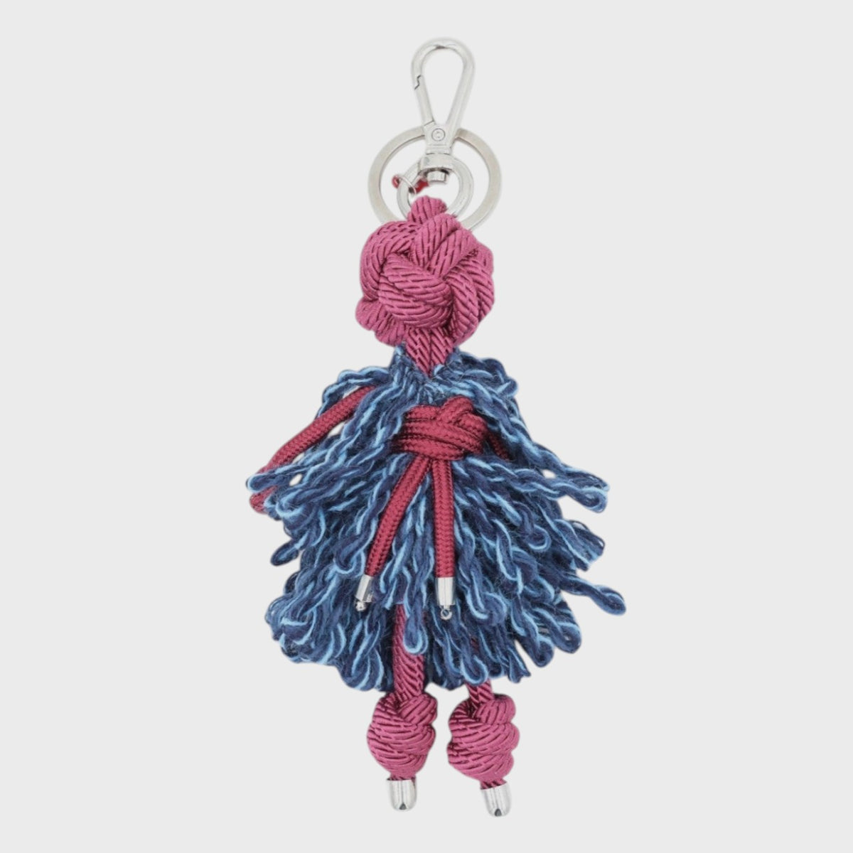 Keychain with blue and pink braided macramé character on a white background