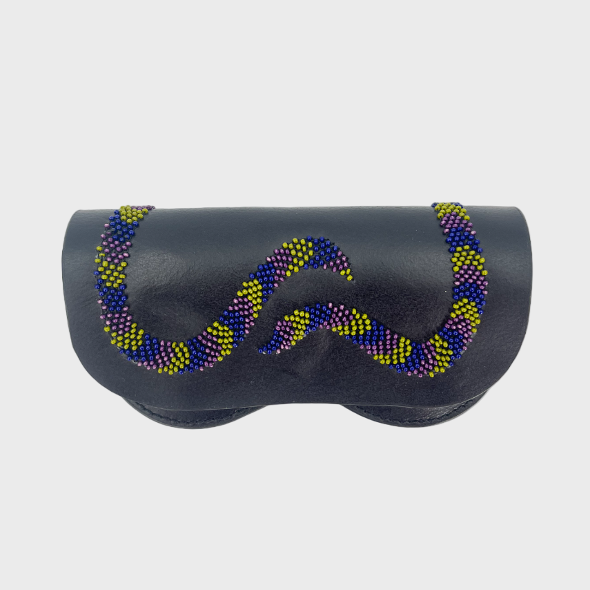 A blue leather glasses case with a yellow, pink and blue embroidered snake on it. 