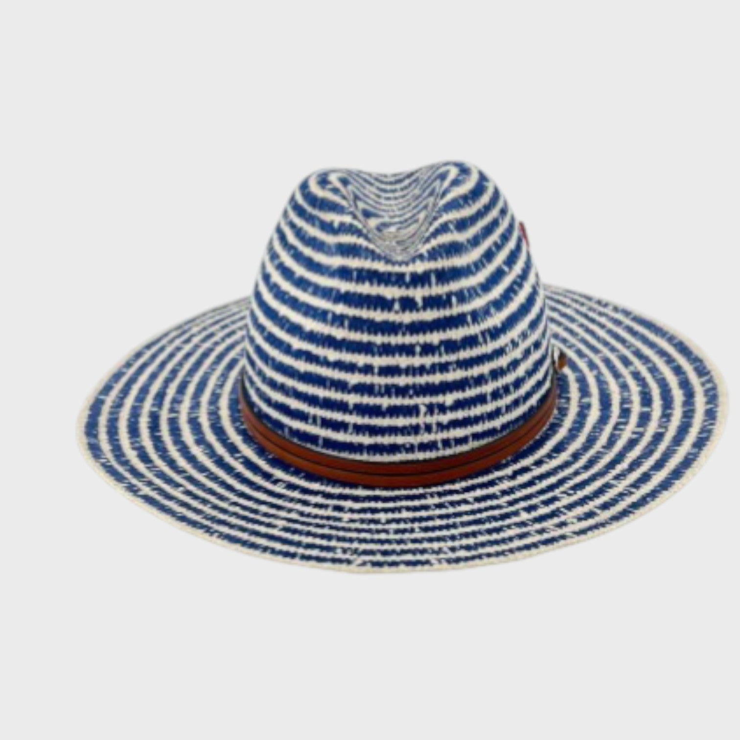 A white and blue striped cotton hat with a brown leather band around it facing the camera