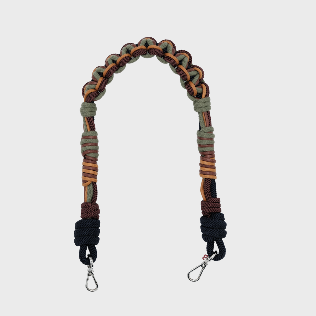 A 60 cm macramé bag strap with blue, green and brown accents. 