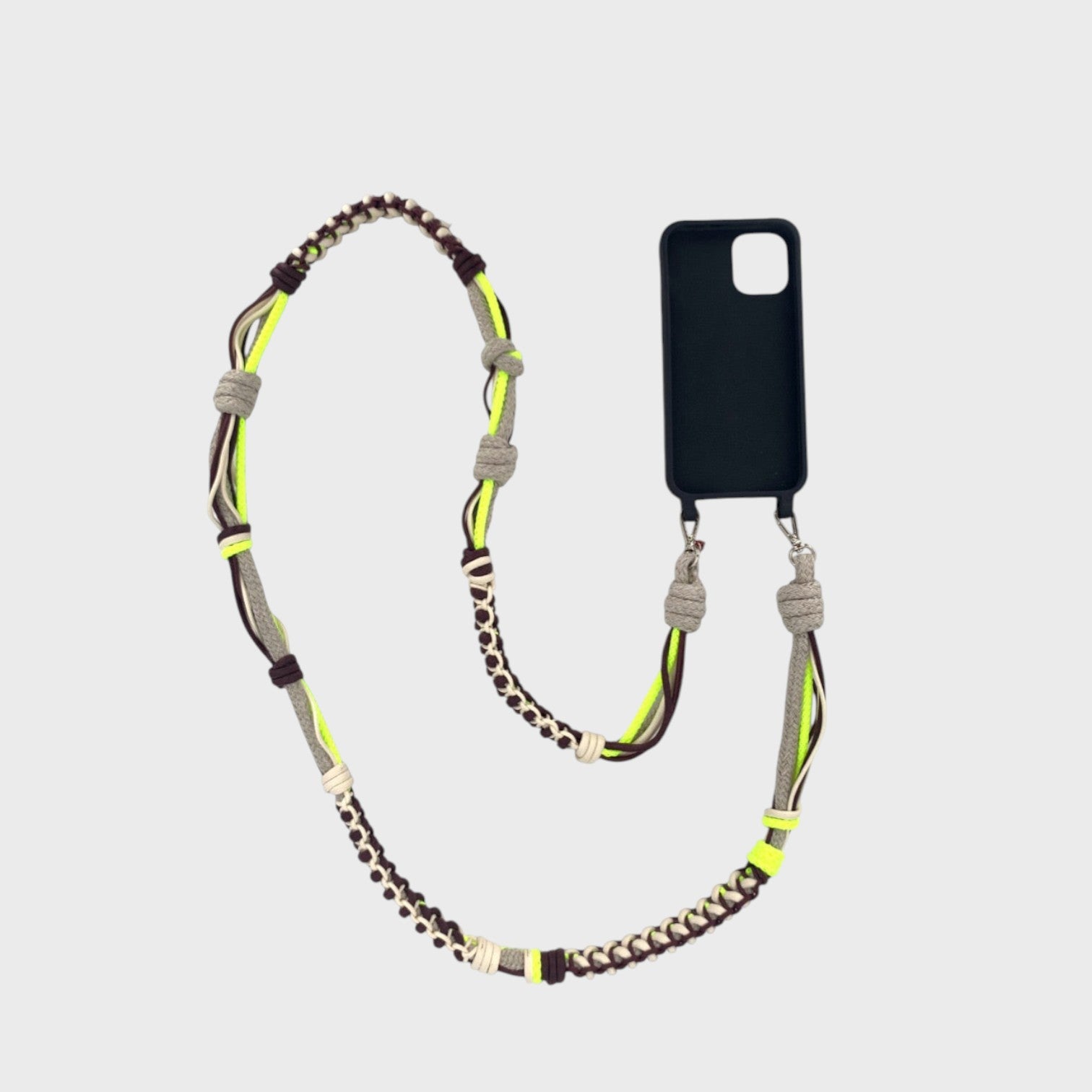 Neon yellow, brown, beige and grey  macramé thick woven phone lanyard with a black phone case on a white background. 