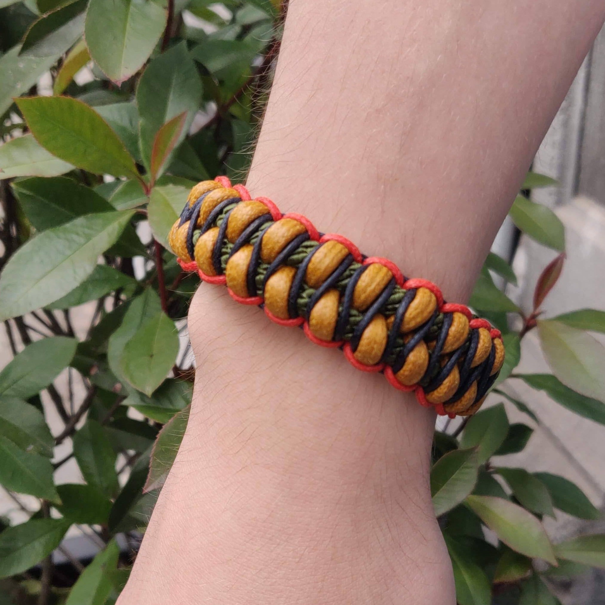 The yellow, green, dark blue and red Emil bracelet worn by a model