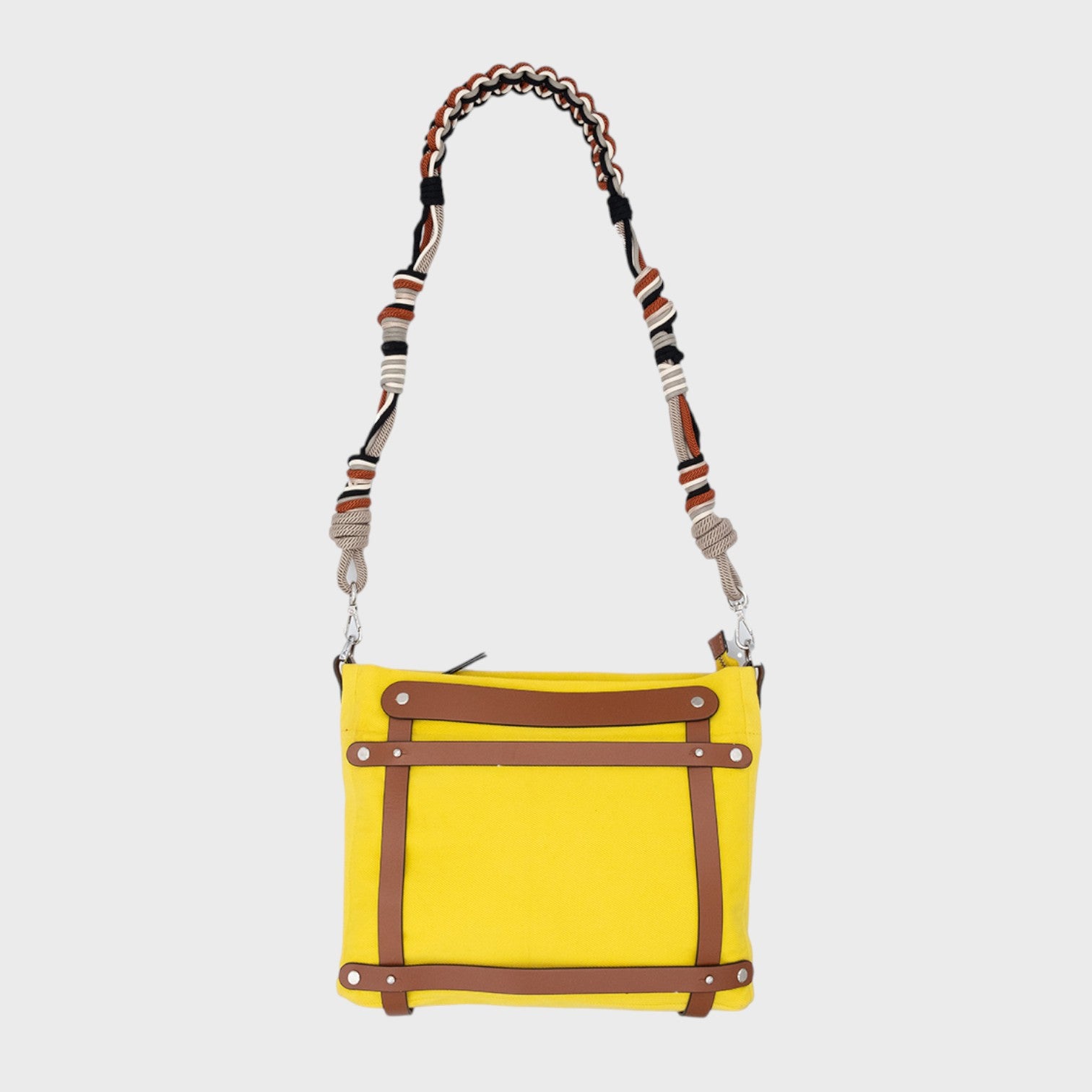 A yellow canvas Minopti mini tote bag with brown leather details and a black, grey and brown beaded strap
