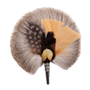 A feather brooch with beige, brown and grey feathers. 
