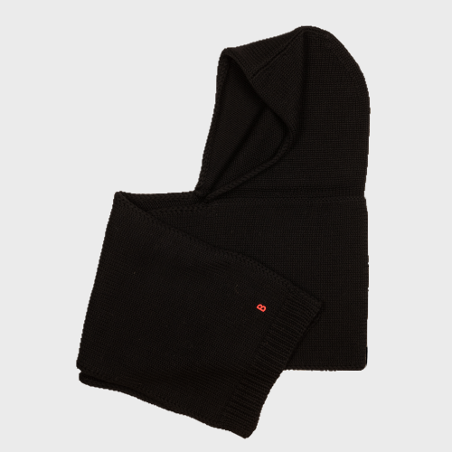 Folded black wool hat scarf on a light gray background