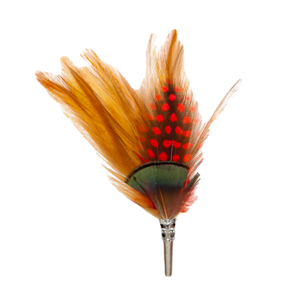 A feather brooch with orange, red and green feathers and a silver metal clasp. 