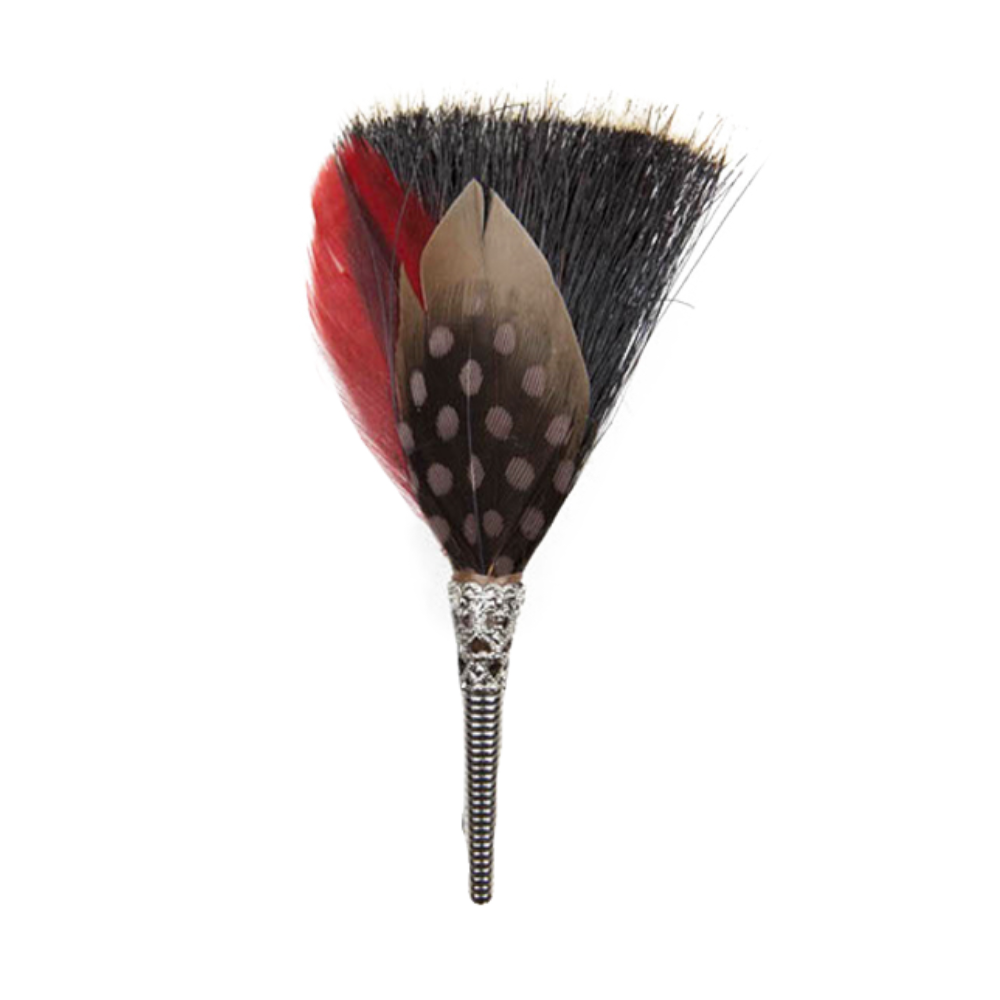 A feather brooch with red, black, and gray colors, attached to a hair accessory, against a white background.